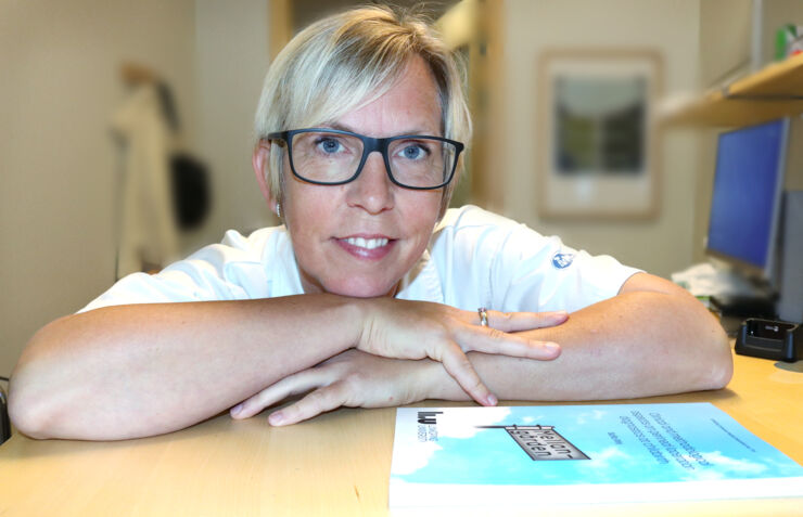 Female physician in a clinic surrounding.