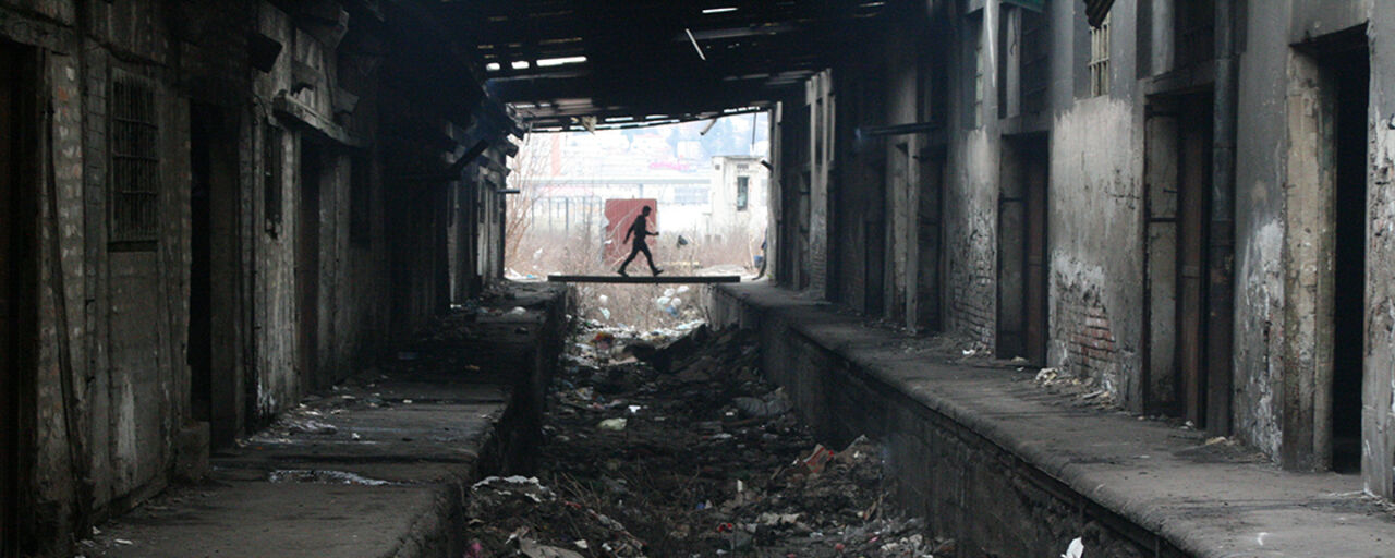 Man in refugee camp behind the Belgrade Central Station