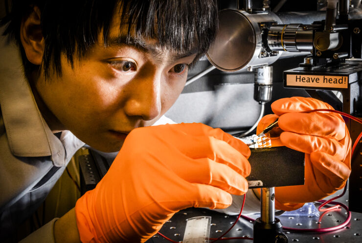 Weidong Xu in the lab working with a perovskite.