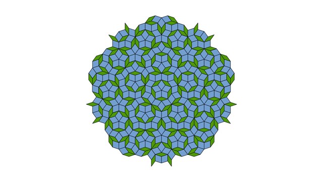 A Penrose tiling with rhombi exhibiting fivefold symmetry.