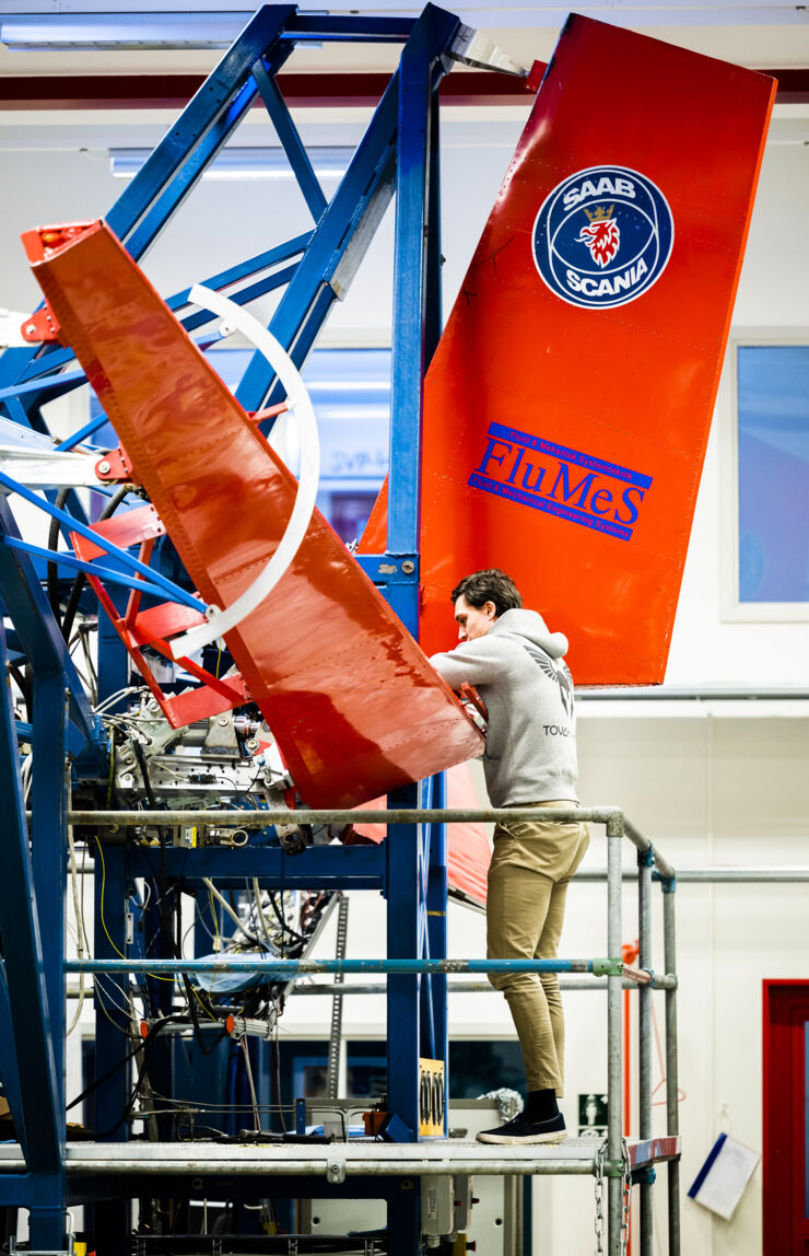 Researcher works on a test rig.