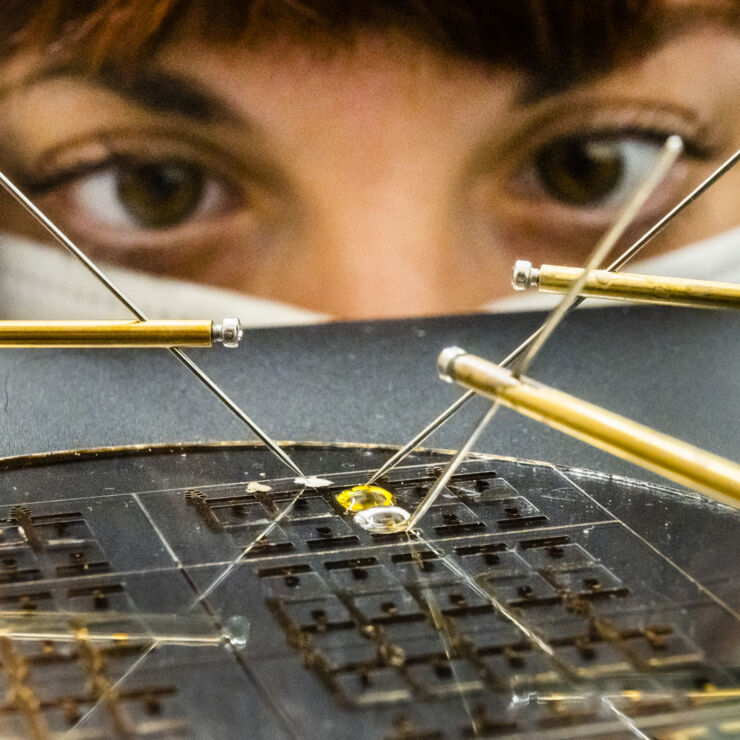 Researcher has a close eye on droplets.