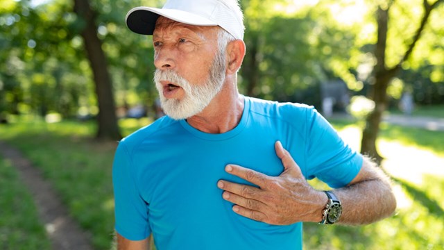 Older man with chest pain during running.
