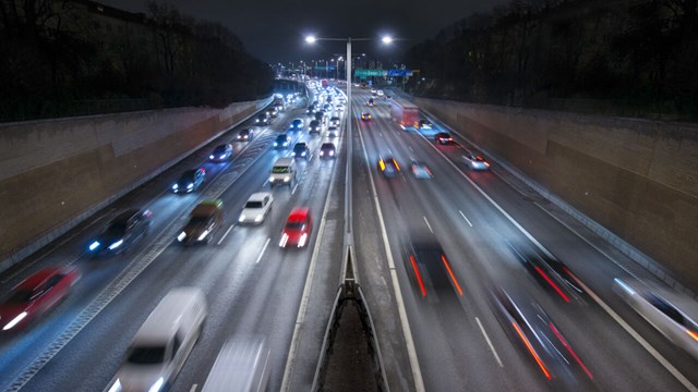 Cars on freeway at night.