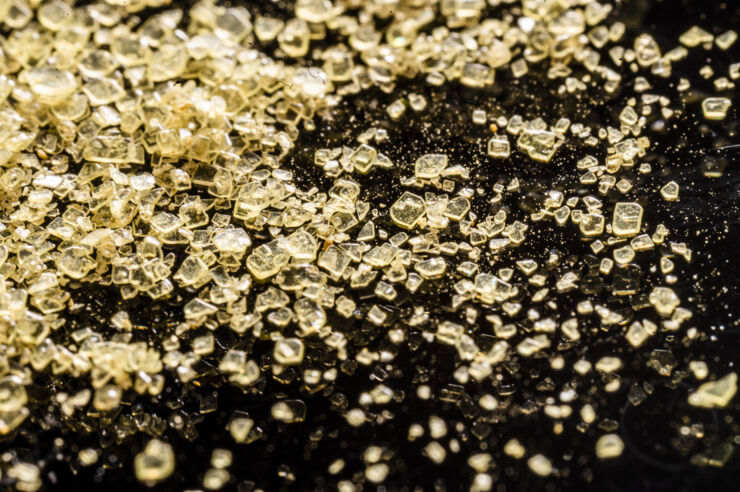 Small yellow crystals on a table.