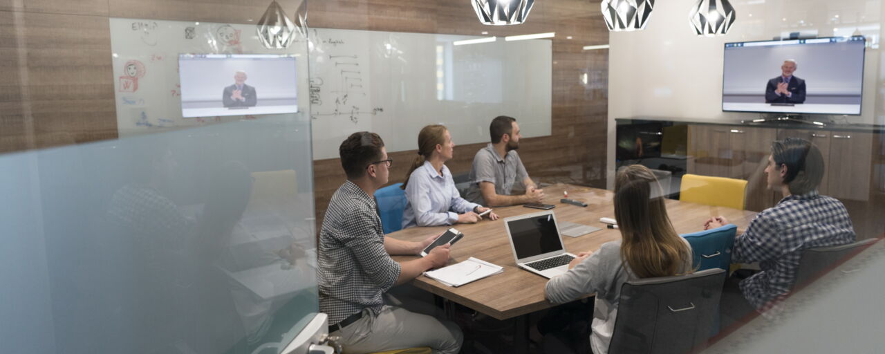 People sitting arround table and having a meeting