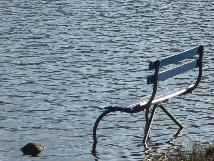 A park bench in water.