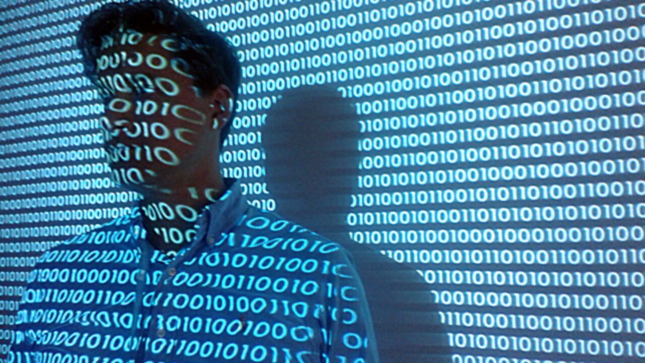 image with digital numbers 0101 and a man