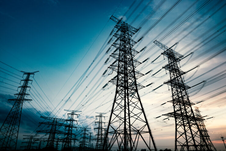 High voltage towers in the dusk of the evening.