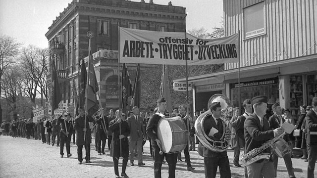 Music parade with flag, drum at the 1st of May demonstration.