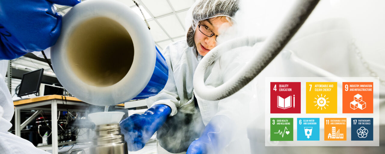 A scientist with hear net is peking trough science equipment and smoke