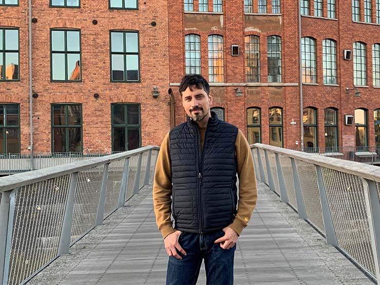 Portrait if a man in front of brick building