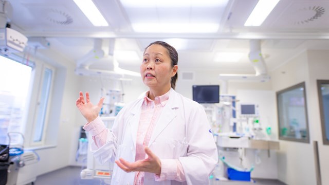 Female scientist in hospital environment.