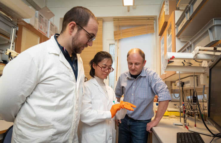 Three researchers in the lab.