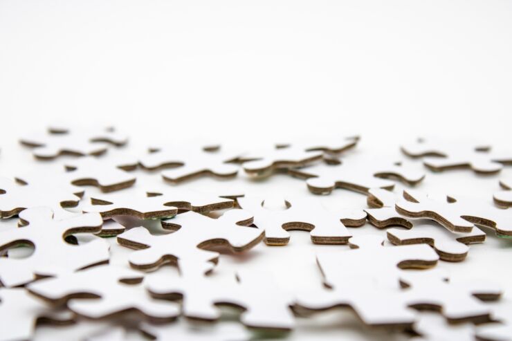 White puzzle pieces against a white background.