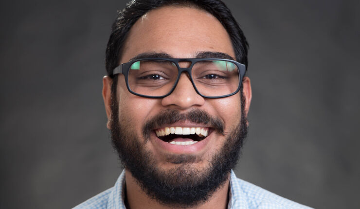 Rohit Muralidharan smiling at the camera.