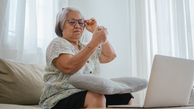 Older woman talking to her doctor digitally