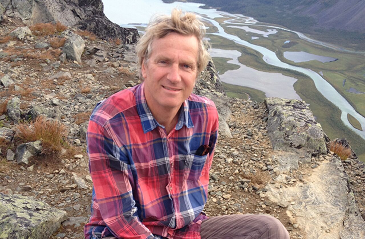 Thomas Kaiserfeld sits on a mountain top.