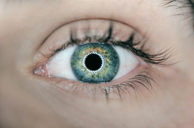 Close up of a person's eye. The eye colour is blue-green.