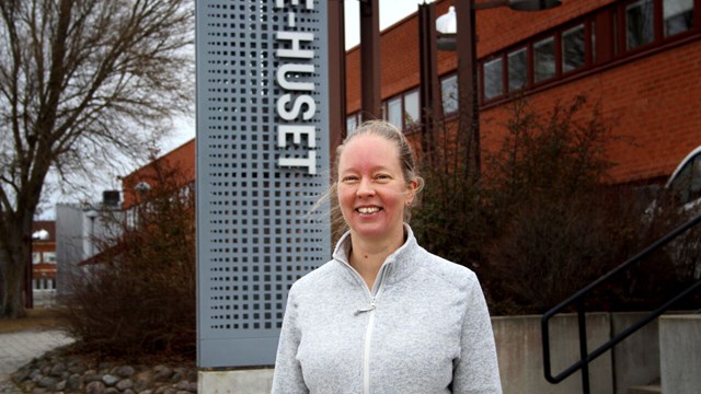 Eva Blomqvist is standing outside the building.