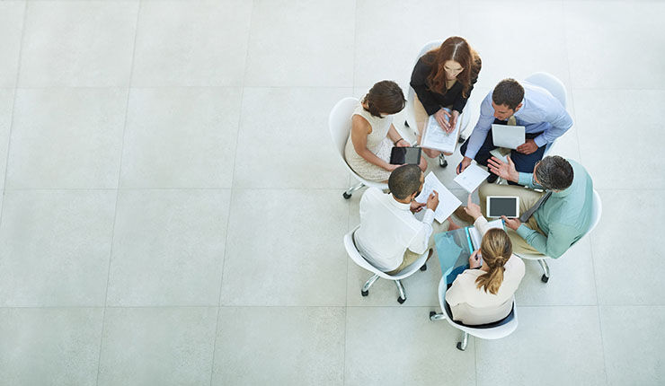 students seated at a round table