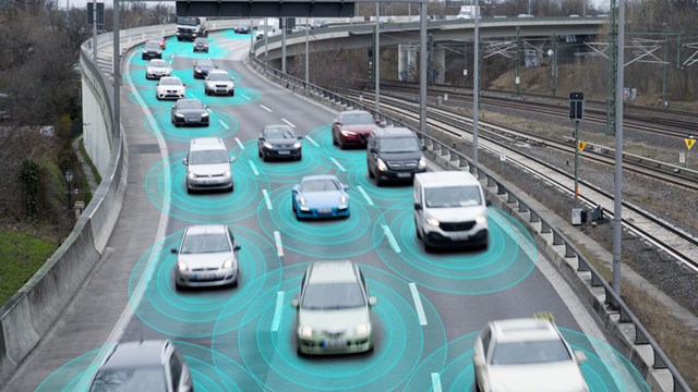 Bilar på väg som illustrerar artificiell intelligens som kan känna avstånd mellan fordonen.