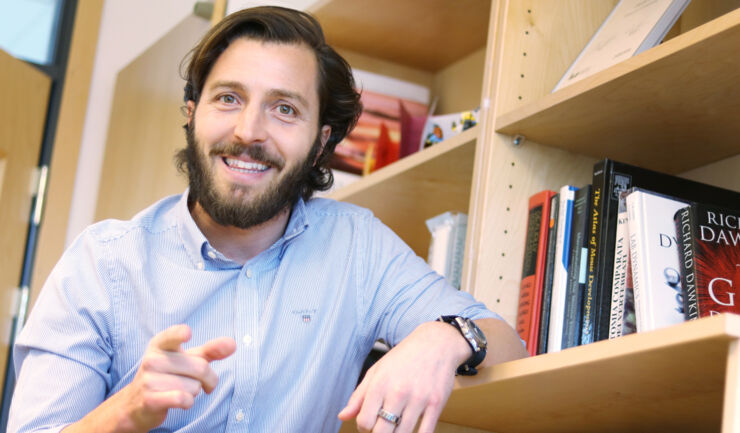 Male researcher in university surrounding.