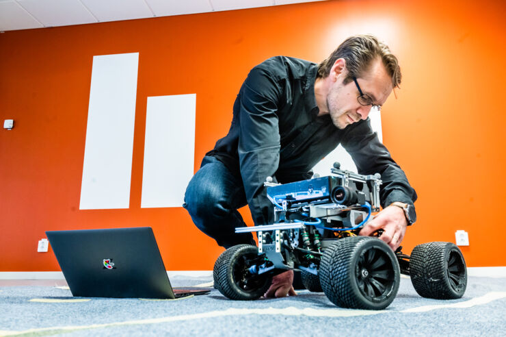 Michael Felsberg with small autonomous car.