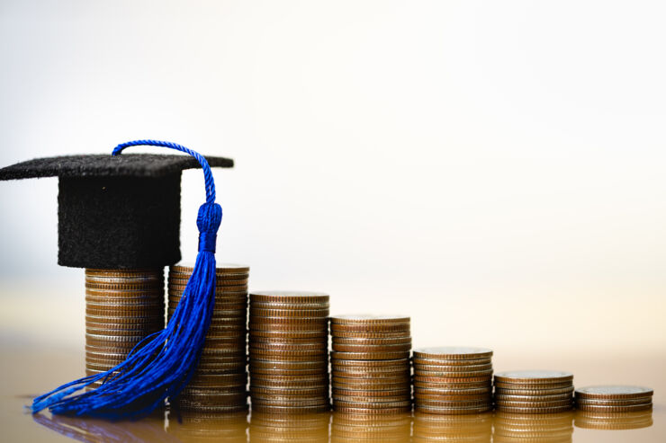 graduation hat on coins