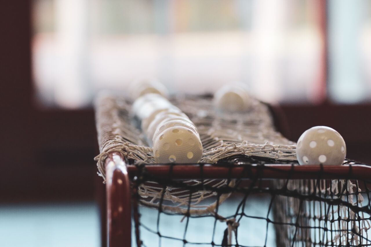 Close up of floorball balls on a goal.