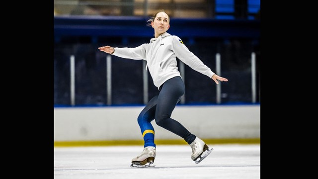 Female figure skater on the ice.