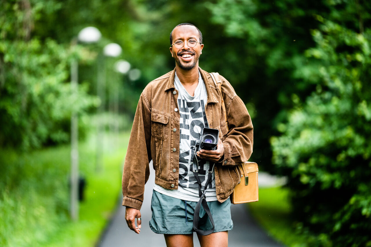Man with a camera outdoors