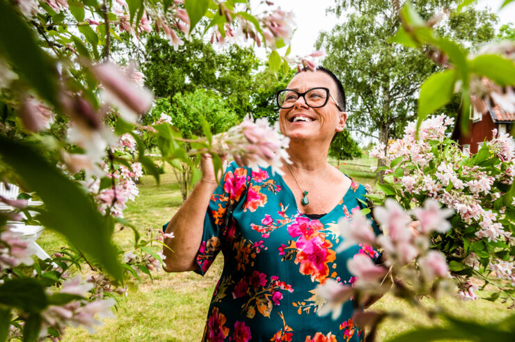 A person stands in a garden.