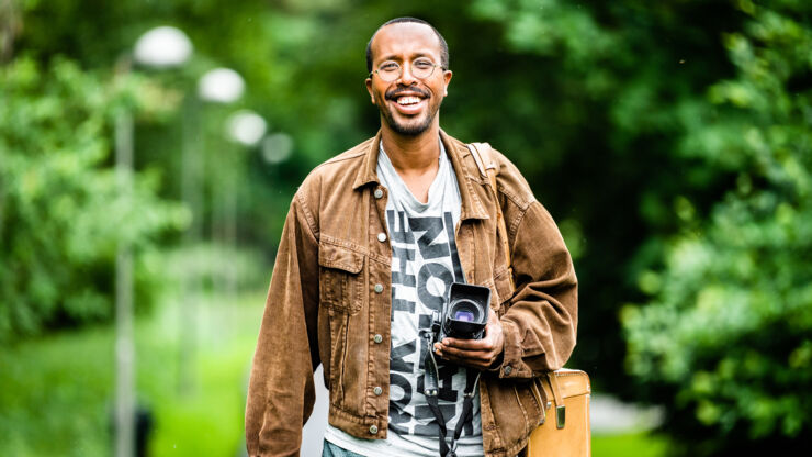 Man with a camera outdoors