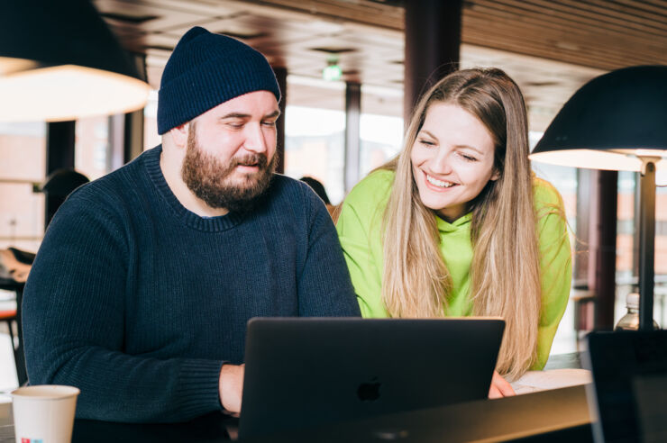 Picture of students and a laptop