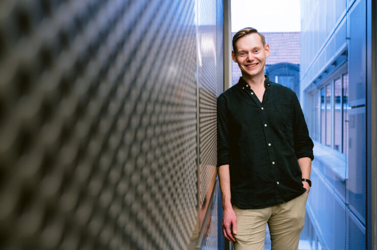 Young man in a corridor.