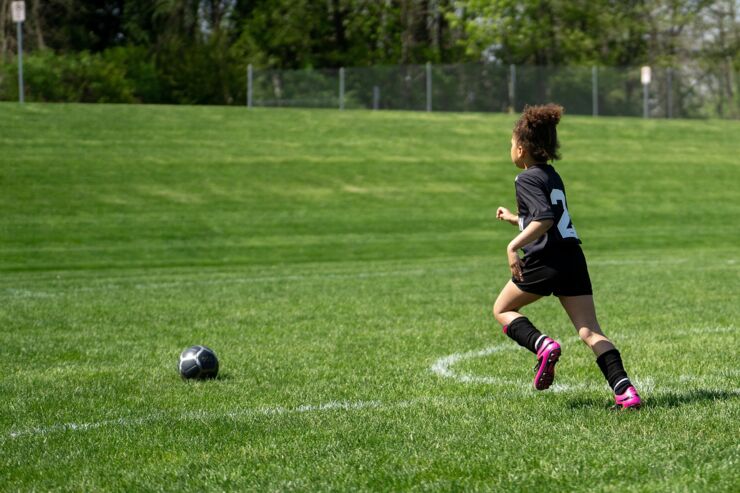 Picture of a girl on a soccer field.