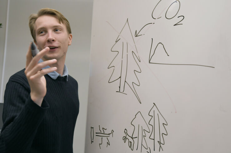 Anton Segerhäll is sketching at a whiteboard.