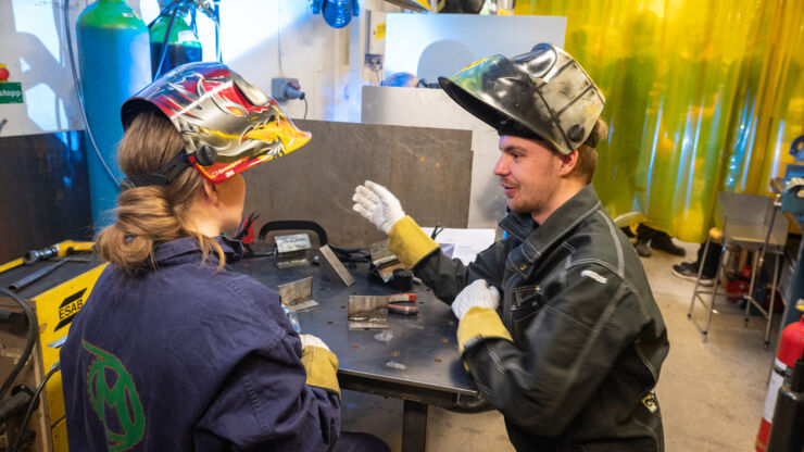 Two students working in the worskhop