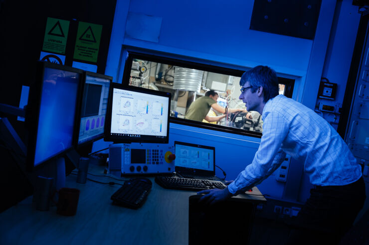 A person looking at a monitor in the lab.