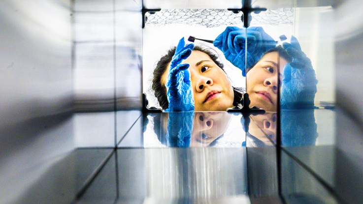 Researcher photographed through an aluminum tube.