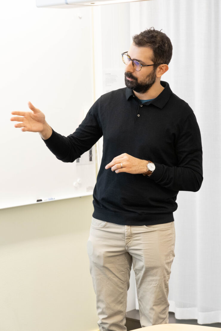 A man presents during a meeting.