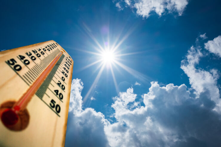 The sun and a thermometer showing high temperatures.