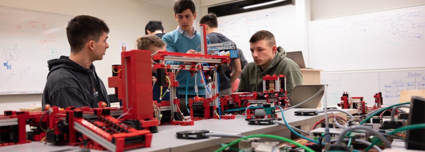 Students and teachers that are solving an experiment.