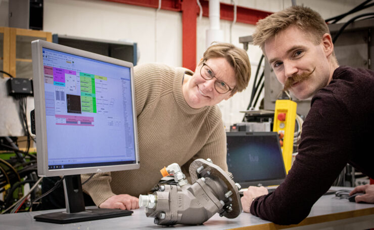 female and male scientist by computor. 