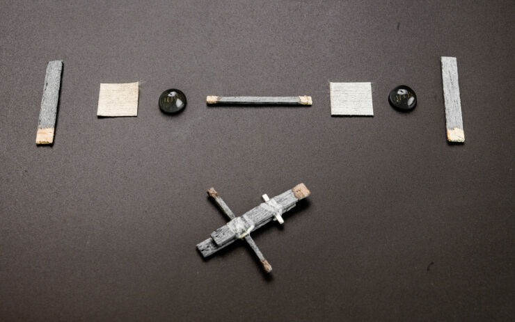 Parts of a wood transistor on a table.