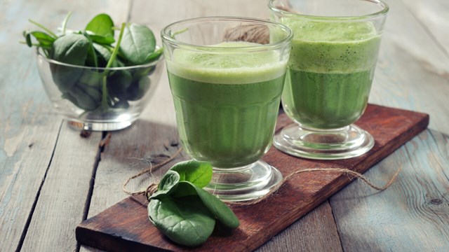 smoothie and spinach leaves.