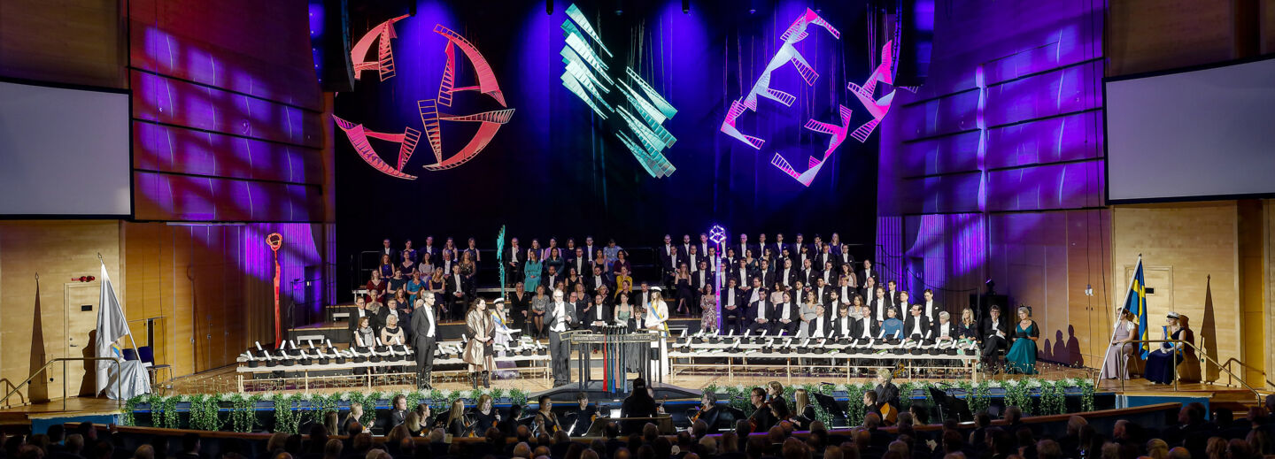 Stage with people wearing formal wear