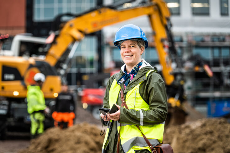 A person in a middle of a constructing site. 