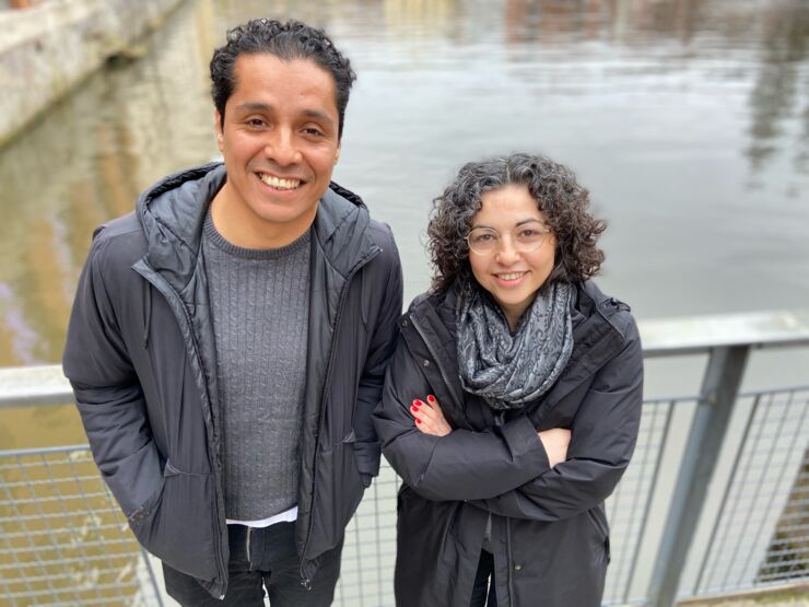 A man and a woman facing the camera.